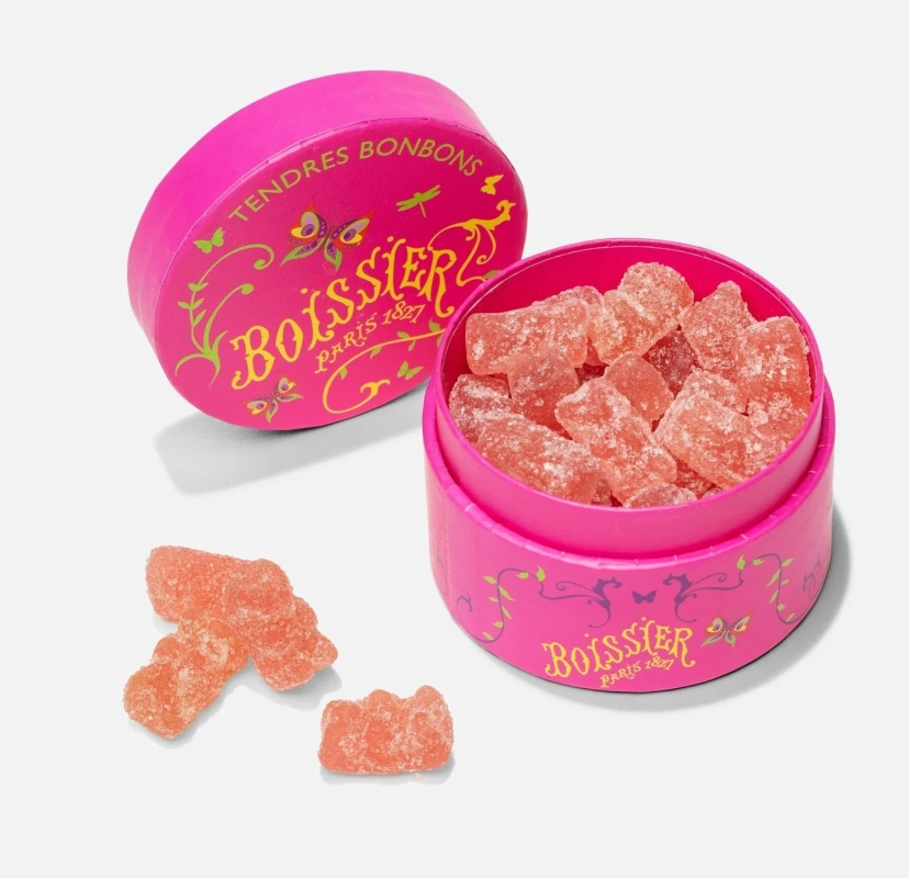 ピンク色の丸い箱に入ったグミキャンディ