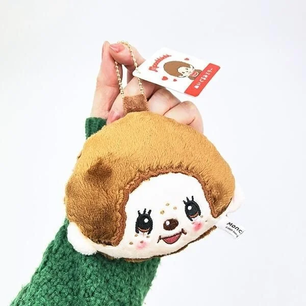 手に持ったモンチッチくんミラー